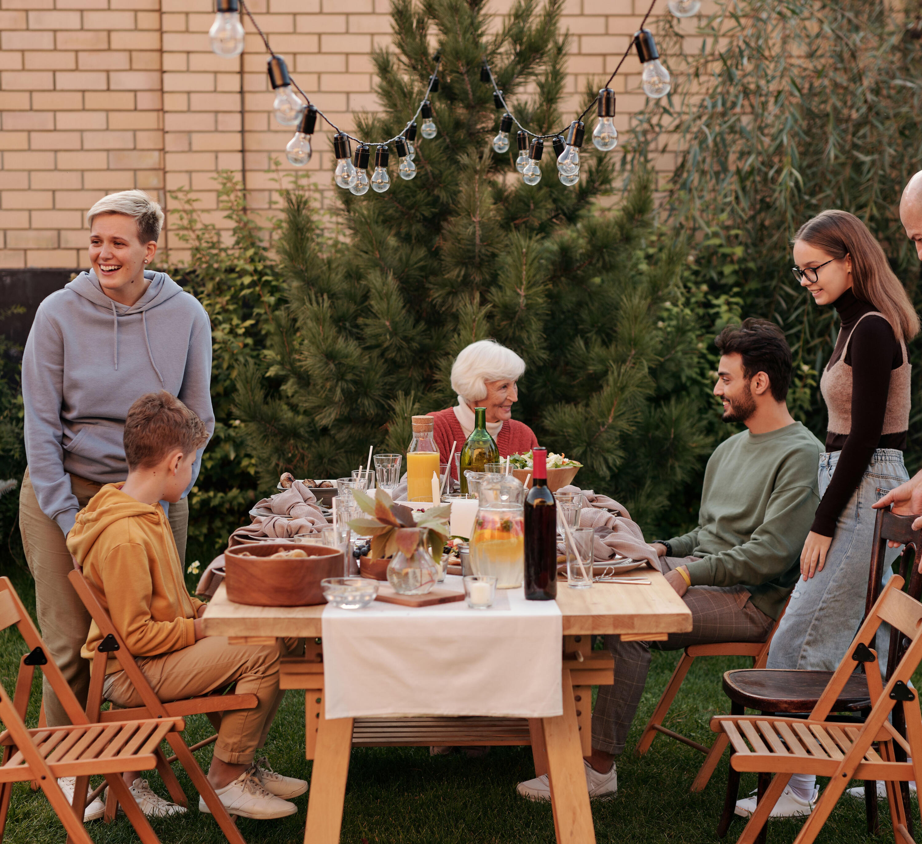 A family gathering over lunch in a backyard